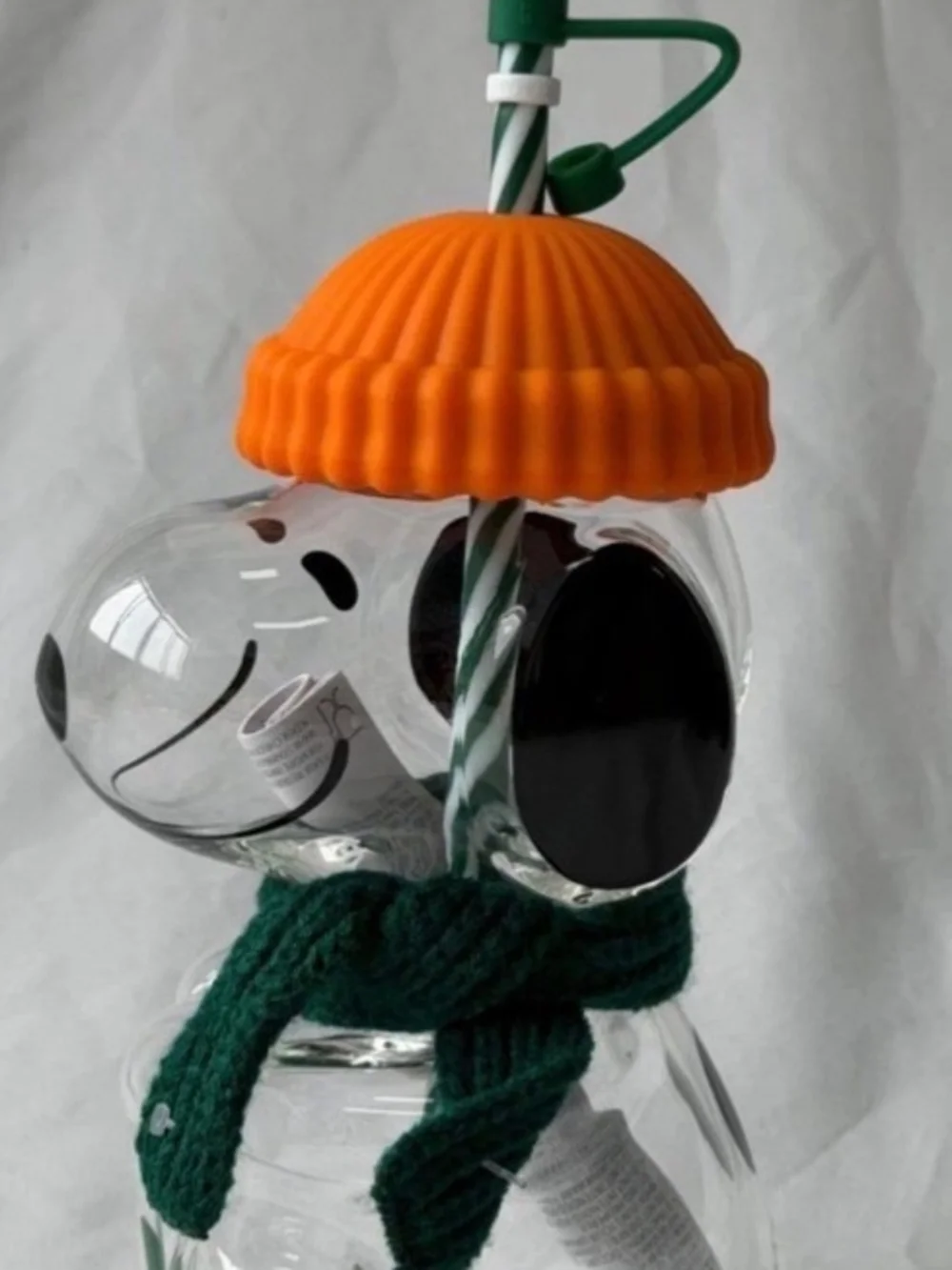 Starbucks Clear Glass Peanuts Snowman Cup with Orange Lid and Green Scarf